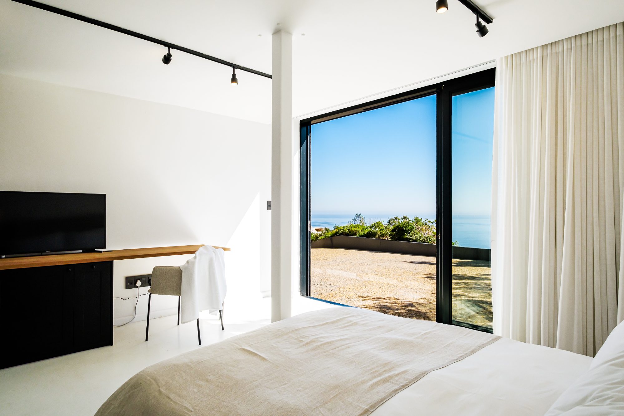 Bedroom IV with desk and ocean view
